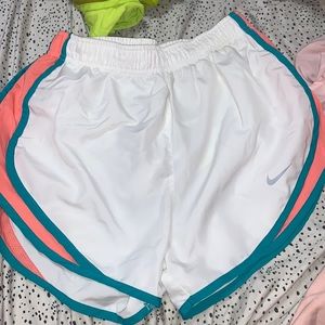 white, teal, and peach nike shorts, size small